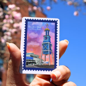A 2" x 3" rectangle sticker featuring HMC dockyard clock.