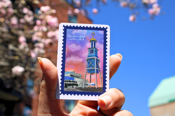 A 2" x 3" rectangle sticker featuring HMC dockyard clock.